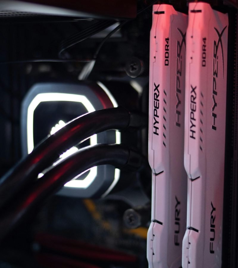 Detailed view of HyperX Fury DDR4 RAM in a gaming PC build with LED lighting.